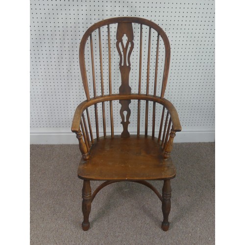 259 - A Late Victorian ash and elm Windsor Chair, stick-back with pierced splat above solid carved base up... 