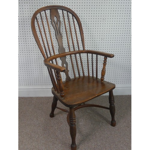 259 - A Late Victorian ash and elm Windsor Chair, stick-back with pierced splat above solid carved base up... 