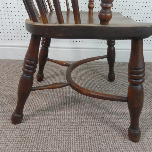 259 - A Late Victorian ash and elm Windsor Chair, stick-back with pierced splat above solid carved base up... 