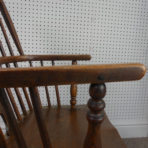 259 - A Late Victorian ash and elm Windsor Chair, stick-back with pierced splat above solid carved base up... 