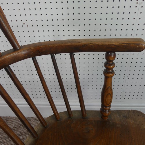 259 - A Late Victorian ash and elm Windsor Chair, stick-back with pierced splat above solid carved base up... 