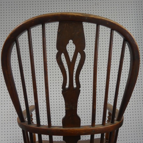 259 - A Late Victorian ash and elm Windsor Chair, stick-back with pierced splat above solid carved base up... 