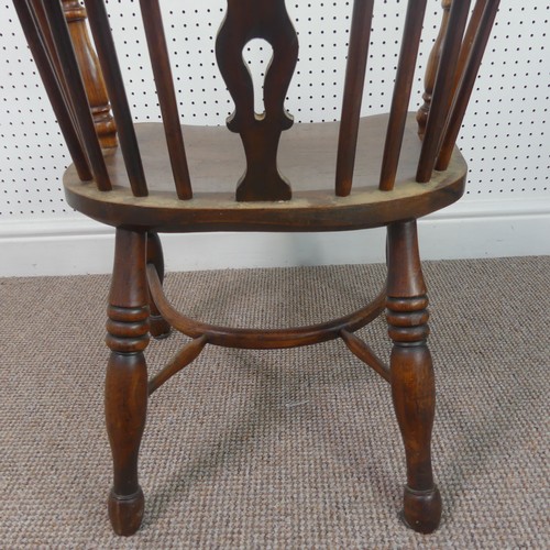 259 - A Late Victorian ash and elm Windsor Chair, stick-back with pierced splat above solid carved base up... 