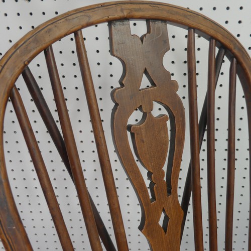 259 - A Late Victorian ash and elm Windsor Chair, stick-back with pierced splat above solid carved base up... 