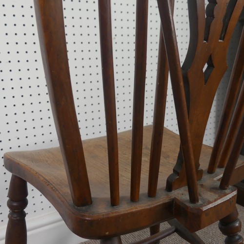 259 - A Late Victorian ash and elm Windsor Chair, stick-back with pierced splat above solid carved base up... 