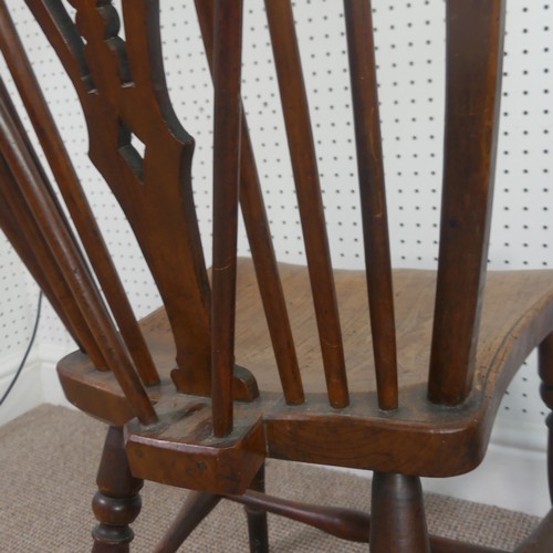 259 - A Late Victorian ash and elm Windsor Chair, stick-back with pierced splat above solid carved base up... 