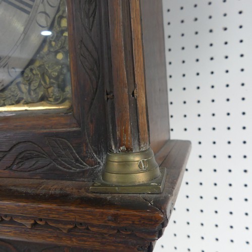 217 - W. Fletcher, Leeds, a carved oak 8-day longcase clock with two-weight movement striking on a bell, t... 