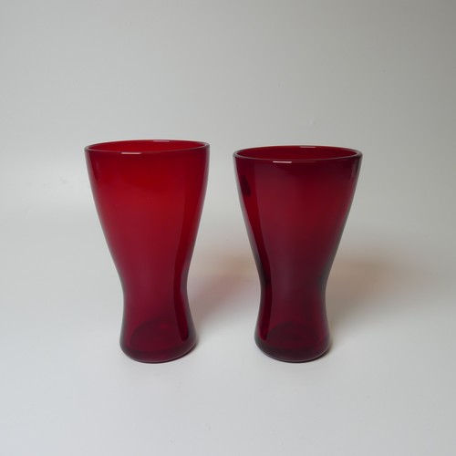 36 - A near pair of Whitefriars glass Goblets, of ruby red colour, one with original sticker, H 18cm, tog... 