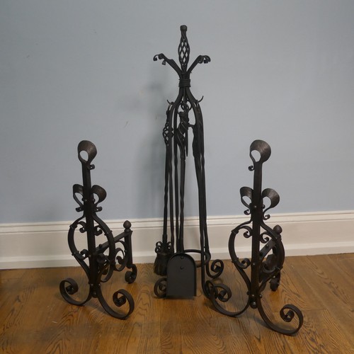 238 - A pair of wrought iron arts and crafts Fire Dogs together with arts and crafts Fire Irons and Stand,... 