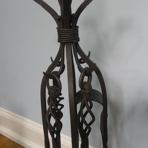 238 - A pair of wrought iron arts and crafts Fire Dogs together with arts and crafts Fire Irons and Stand,... 