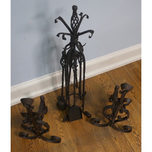 238 - A pair of wrought iron arts and crafts Fire Dogs together with arts and crafts Fire Irons and Stand,... 