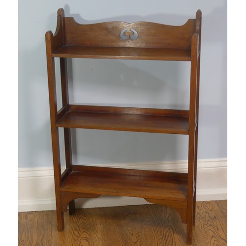 268 - A walnut free standing three shelved Arts and Crafts inspired Bookcase, with open back and pierced d... 