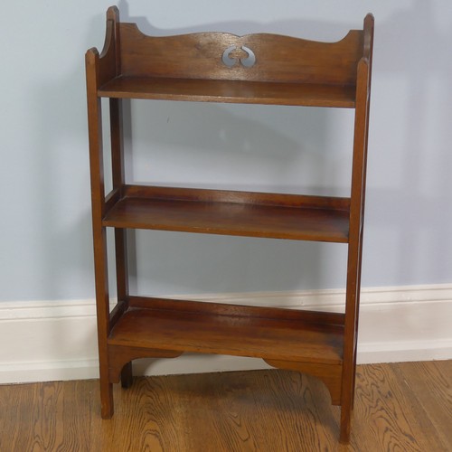 268 - A walnut free standing three shelved Arts and Crafts inspired Bookcase, with open back and pierced d... 