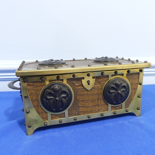 269 - A brass and leatherette Arts and crafts jewelry box, with decorative metal motives and studs, W 31 c... 