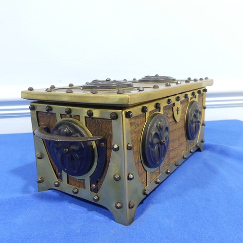 269 - A brass and leatherette Arts and crafts jewelry box, with decorative metal motives and studs, W 31 c... 