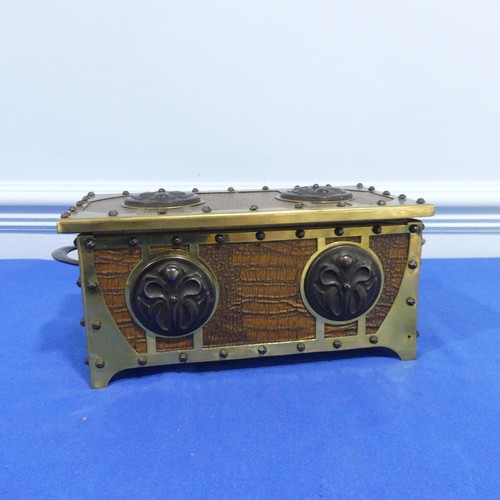 269 - A brass and leatherette Arts and crafts jewelry box, with decorative metal motives and studs, W 31 c... 