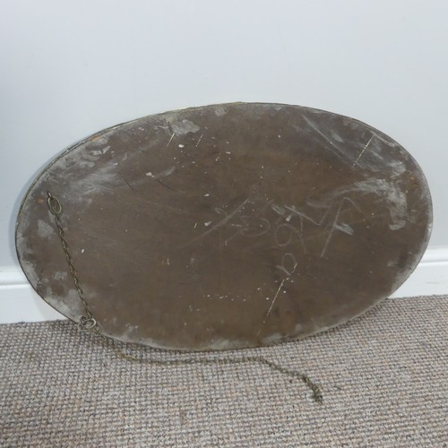 270 - An Arts & Crafts oval brass mirror with decorative overlay to four of its edges, has it's origin... 