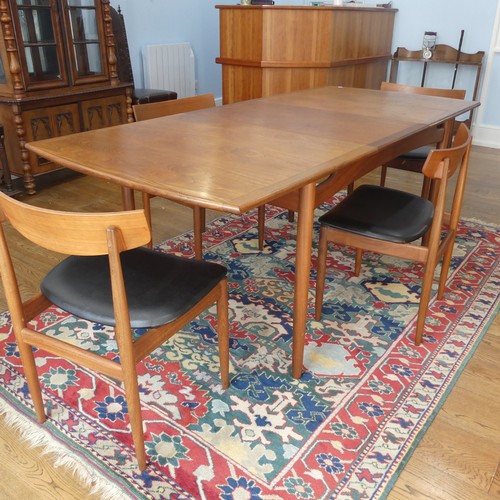 273 - A 1960s G-Plan draw leaf 'Brasilia' teak Dining Table, together with a set of four chairs upholstere... 