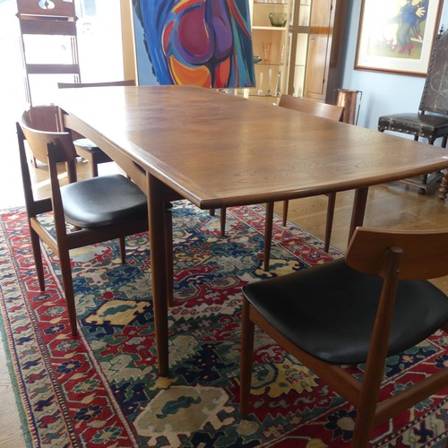 273 - A 1960s G-Plan draw leaf 'Brasilia' teak Dining Table, together with a set of four chairs upholstere... 