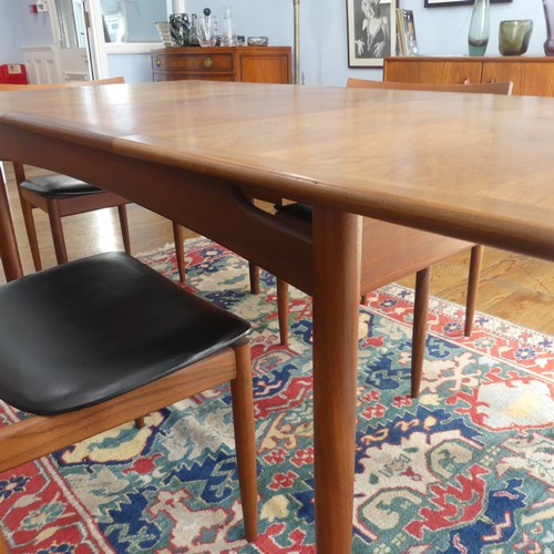 273 - A 1960s G-Plan draw leaf 'Brasilia' teak Dining Table, together with a set of four chairs upholstere... 