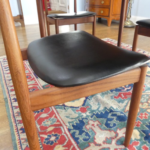 273 - A 1960s G-Plan draw leaf 'Brasilia' teak Dining Table, together with a set of four chairs upholstere... 