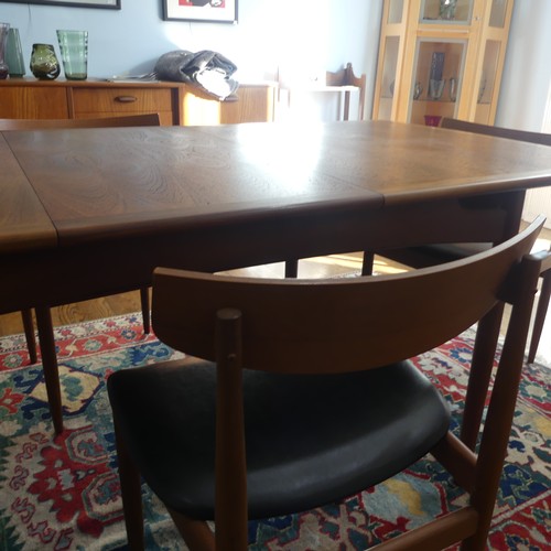 273 - A 1960s G-Plan draw leaf 'Brasilia' teak Dining Table, together with a set of four chairs upholstere... 