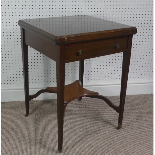 274 - An Edwardian mahogany envelope card table, having single frieze drawer, raised platform undertier, W... 