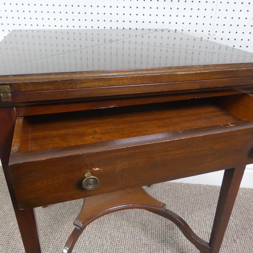 274 - An Edwardian mahogany envelope card table, having single frieze drawer, raised platform undertier, W... 