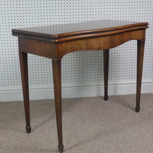 275 - A Victorian mahogany serpentine fold over Card Table, on square tapering legs, signs of woodworm on ... 