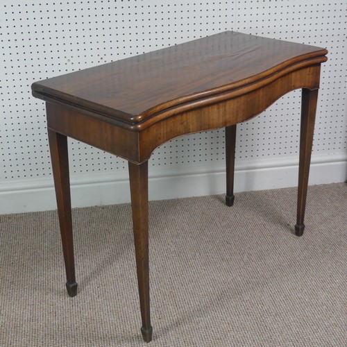 275 - A Victorian mahogany serpentine fold over Card Table, on square tapering legs, signs of woodworm on ... 