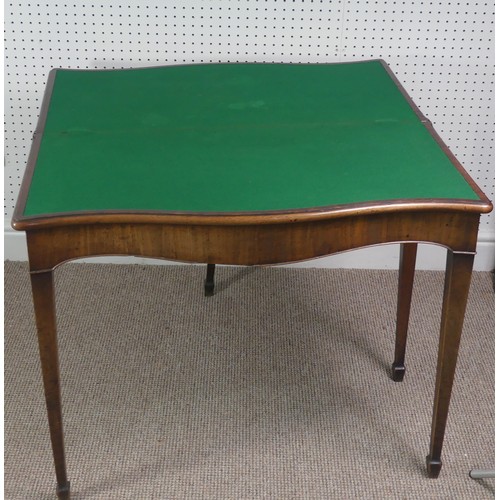 275 - A Victorian mahogany serpentine fold over Card Table, on square tapering legs, signs of woodworm on ... 