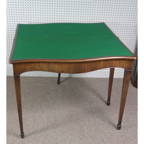 275 - A Victorian mahogany serpentine fold over Card Table, on square tapering legs, signs of woodworm on ... 