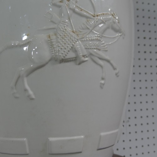 277 - A mid 20thC porcelain table Lamp, the white porcelain base depicting archers on horseback and carria... 