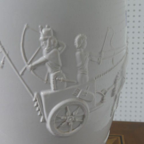 277 - A mid 20thC porcelain table Lamp, the white porcelain base depicting archers on horseback and carria... 