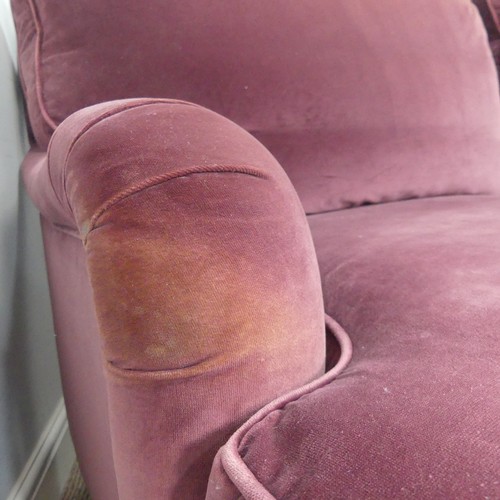 279 - A good quality Howard style, club two seater sofa, upholstered in purple with some fading near the t... 