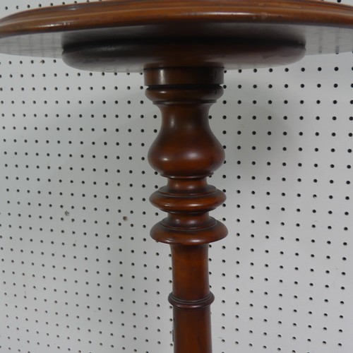 280 - A late Victorian mahogany plant stand/tall wine table, circular top upon turned column supported by ... 