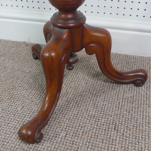 280 - A late Victorian mahogany plant stand/tall wine table, circular top upon turned column supported by ... 