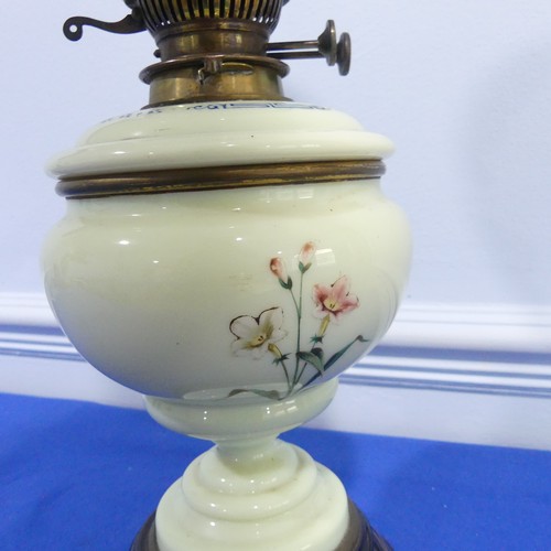 282 - A 19th century Hinks & Sons Patent, brass and milk glass oil lamp with green painted body, W 20 ... 