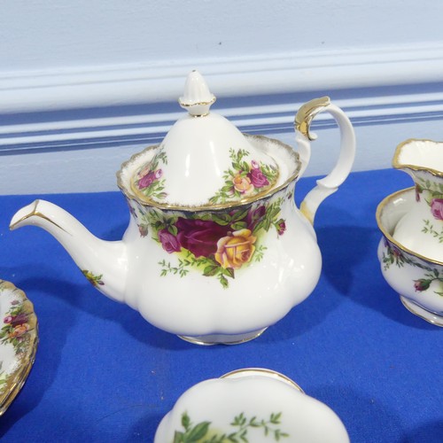 52 - A Royal Albert 'Old Country Roses' pattern Tea Set, comprising Teapot, six Teacups and Saucers, two ... 