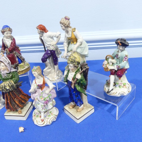 63 - A small quantity of Sitzendorf porcelain Figures, to comprise a worker with spade, a pair of two you... 