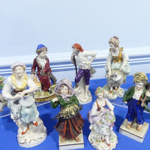 63 - A small quantity of Sitzendorf porcelain Figures, to comprise a worker with spade, a pair of two you... 