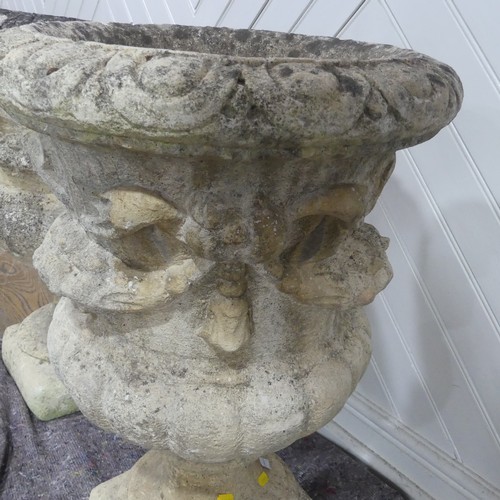 403 - A pair of Reconstituted stone classical Garden Urns with swag decoration raised on base, W 50 cm x H... 