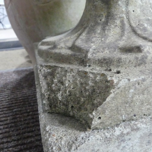 404 - A late 20th Century composite stone half fluted terrace vase or urn, on moulded plinth base and stan... 