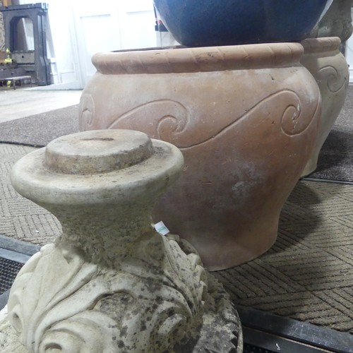 404 - A late 20th Century composite stone half fluted terrace vase or urn, on moulded plinth base and stan... 