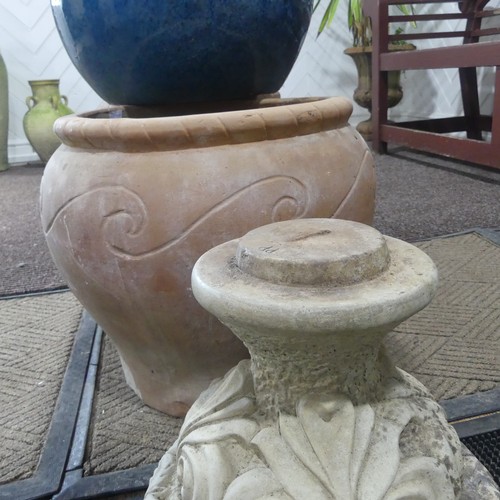 404 - A late 20th Century composite stone half fluted terrace vase or urn, on moulded plinth base and stan... 