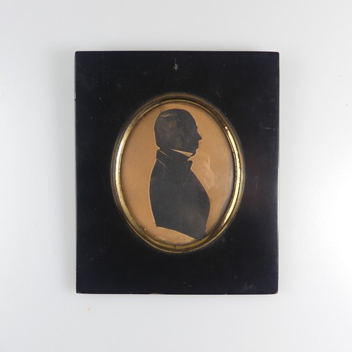 158 - Attributed to William Alport (fl. 1830), Silhouette portrait of a young man profile to sinister, pai... 