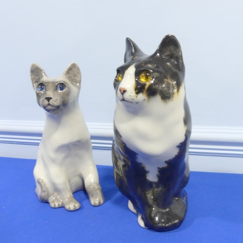 70 - A pair of Winstanley pottery Cat Figures sitting, both with glass eyes and signed bases, H 29 cm.... 