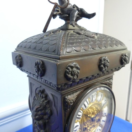 231 - A French bronzed-metal Mantel Clock, late 19th century, the architectural case surmounted with an ch... 