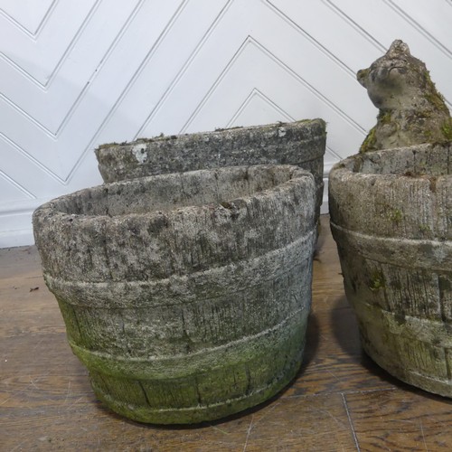 406 - A lot of five weathered reconstituted stone planters, shaped and carved to look like wooden barrels,... 