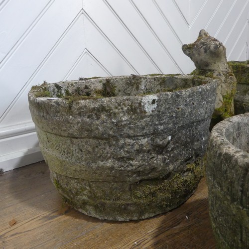 406 - A lot of five weathered reconstituted stone planters, shaped and carved to look like wooden barrels,... 